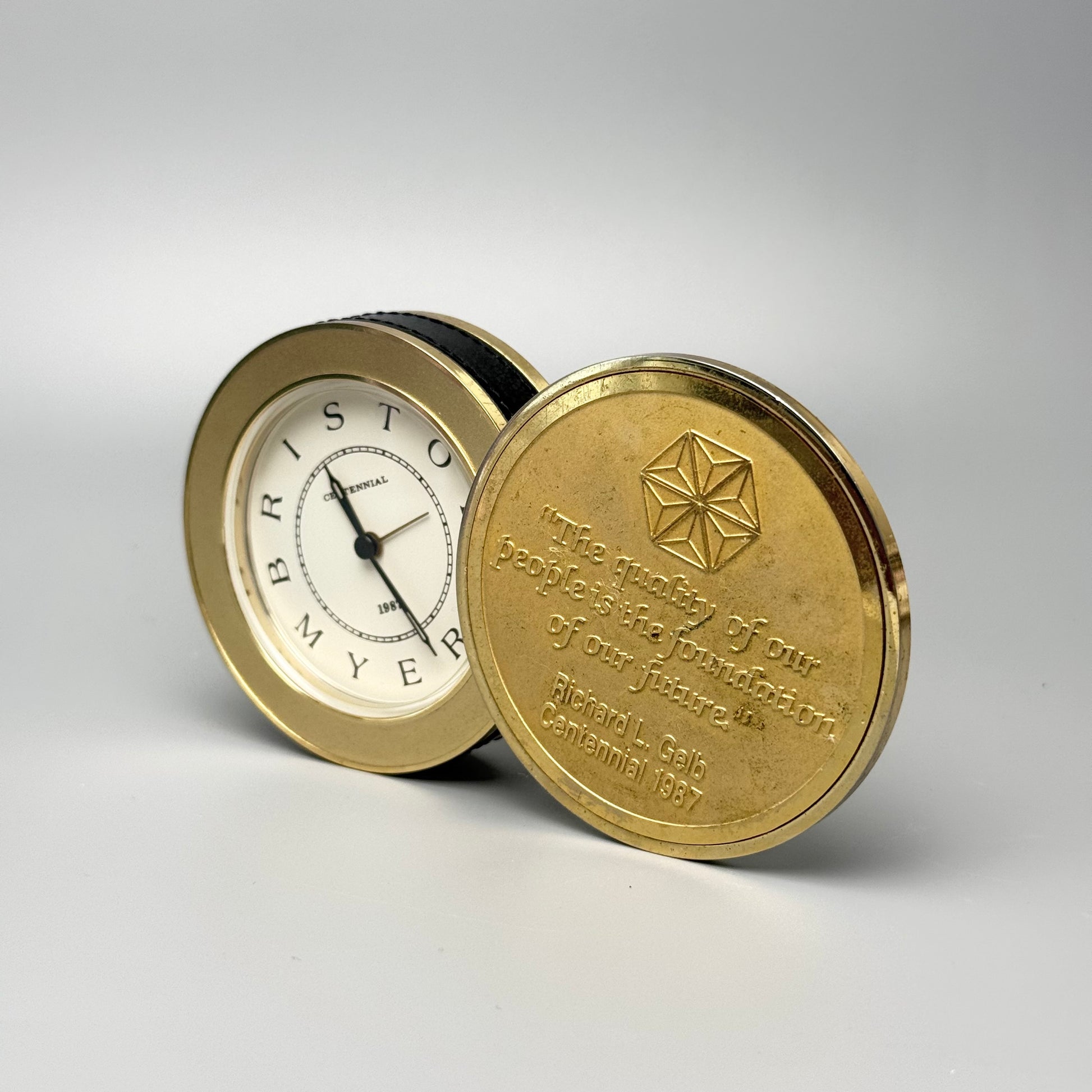 Bristol-Myers Centennial 1987 bordur/rejseur med alarm – firmamemorabilia