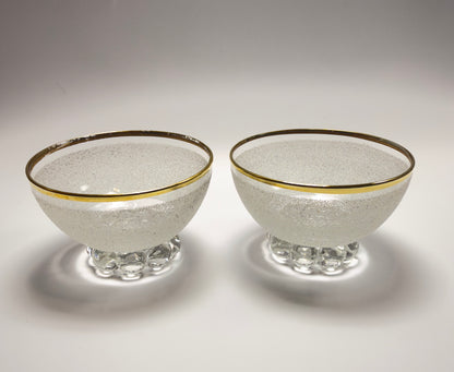 A set of vintage coupe glasses / dessert glasses with rough granulated glass surface and gold rim