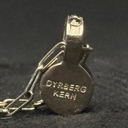 Dyrberg/Kern halskæde med brun designerkrystal og guldfarvet kæde