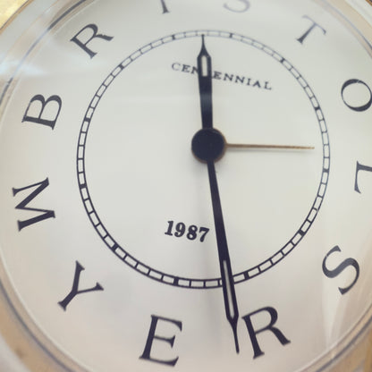 Bristol-Myers Centennial 1987 bordur/rejseur med alarm – firmamemorabilia
