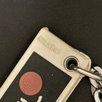 Lee Cooper nøglering med kontaktkort – “sol på lommen” vintage reklame